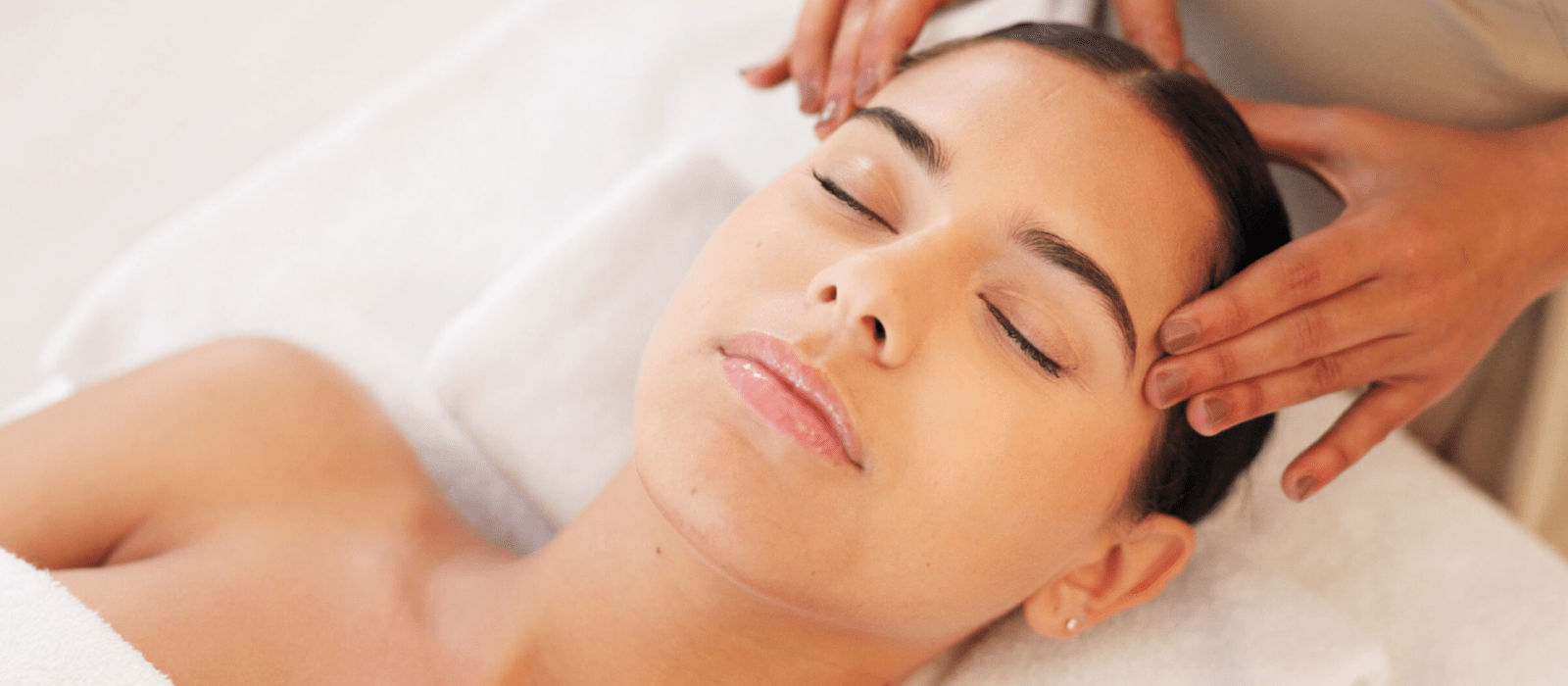 woman relaxed getting facial